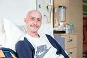 A young person with cancer being treated on a Teenage Cancer Trust unit
