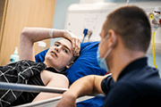A young person with cancer being treated on a Teenage Cancer Trust unit